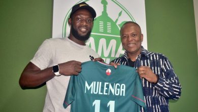Striker Augustine Mulenga and AmaZulu FC President Sandile Zungu.