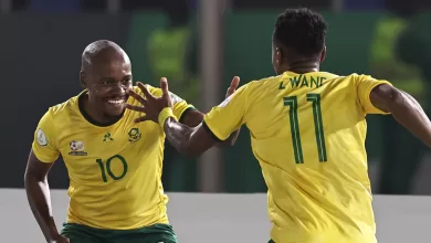 Percy Tau celebraing a goal with Bafana Bafana teammate Themba Zwane in an AFCON game